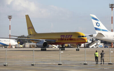 File: A plane of the international courier company DHL, carrying over 100,000 doses of the first batch of Pfizer coronavirus vaccines, lands at Ben Gurion Airport near Tel Aviv, Wednesday, Dec. 9, 2020 (Abir Sultan/Pool Photo via AP)