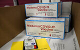 Boxes containing the Moderna COVID-19 vaccine are prepared to be shipped at the McKesson distribution center in Olive Branch, Mississippi, Dec. 20, 2020. (AP Photo/Paul Sancya, Pool)