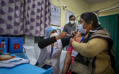 A health worker engages in a COVID-19 vaccine delivery system trial in New Delhi, India, Jan. 2, 2021 (AP Photo/Altaf Qadri) A health worker engages in a COVID-19 vaccine delivery system trial in New Delhi, India, Jan. 2, 2021 (AP Photo/Altaf Qadri)