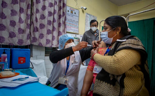 A health worker engages in a COVID-19 vaccine delivery system trial in New Delhi, India, Jan. 2, 2021 (AP Photo/Altaf Qadri) A health worker engages in a COVID-19 vaccine delivery system trial in New Delhi, India, Jan. 2, 2021 (AP Photo/Altaf Qadri)