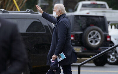 President-elect Joe Biden waves as he walks from St. Edmond Catholic Church after attending Mass in Rehoboth Beach, Del., January 3, 2021. (AP Photo/Carolyn Kaster)