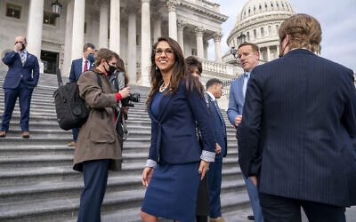 Representative Lauren Boebert of Colorado, center, smiles after joining other freshman Republican House members for a group photo at the Capitol in Washington, January 4, 2021. (AP Photo/J. Scott Applewhite) Representative Lauren Boebert of Colorado, center, smiles after joining other freshman Republican House members for a group photo at the Capitol in Washington, January 4, 2021. (AP Photo/J. Scott Applewhite)