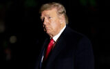 US President Donald Trump arrives in the early morning hours, Tuesday, Jan. 5, 2021, at the White House in Washington, after returning from a rally in Dalton, Georgia (AP Photo/Andrew Harnik)