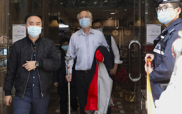 American human rights lawyer John Clancey, center, is arrested by police in Hong Kong, January 6, 2021. (Apple Daily/AP) American human rights lawyer John Clancey, center, is arrested by police in Hong Kong, January 6, 2021. (Apple Daily/AP)