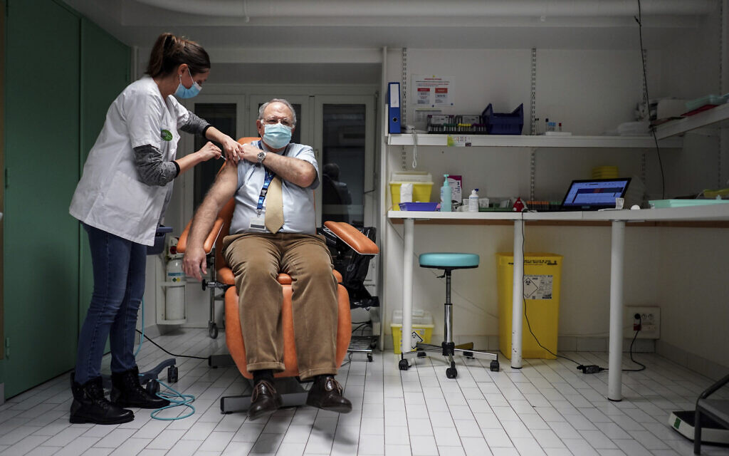Dr. Christian Chidiac gets a Pfizer-BioNTech COVID-19 vaccine in La Croix-Rousse hospital, in Lyon, central France, Wednesday Jan. 6, 2021 (AP Photo/Laurent Cipriani) Dr. Christian Chidiac gets a Pfizer-BioNTech COVID-19 vaccine in La Croix-Rousse hospital, in Lyon, central France, Wednesday Jan. 6, 2021 (AP Photo/Laurent Cipriani)
