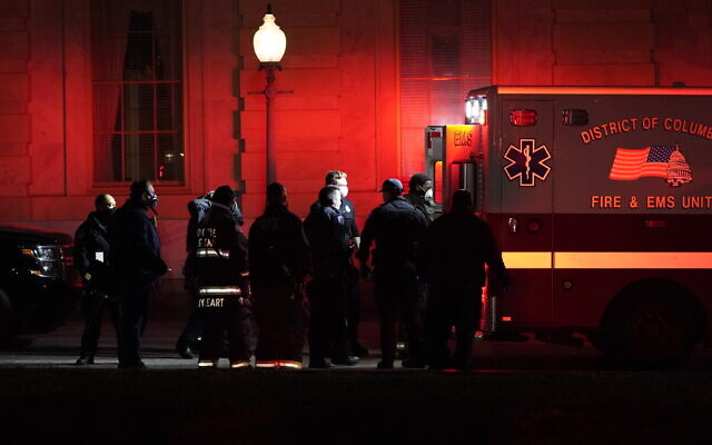 A person on a stretcher is placed in an ambulance outside the US Capitol, January 6, 2021, in Washington. (AP Photo/Jacquelyn Martin) A person on a stretcher is placed in an ambulance outside the US Capitol, January 6, 2021, in Washington. (AP Photo/Jacquelyn Martin)