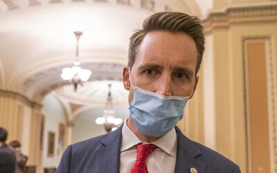 Sen. Josh Hawley, Republican-Missouri, speaks to reporters as he returns to the Senate Chamber at the Capitol, in Washington, January 7, 2021. (Manuel Balce Ceneta/AP)