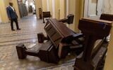 Sen. Tim Scott, R-S.C., stops to look at damage in the early morning hours of Thursday, January 7, 2021, after protesters stormed the Capitol in Washington, on Wednesday. (AP/Andrew Harnik)