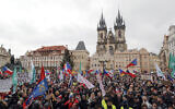 Demonstrators gather during a protest against the government restriction measures to curb the spread of COVID-19, in Prague, Czech Republic, January 10, 2021. (AP Photo/Petr David Josek)