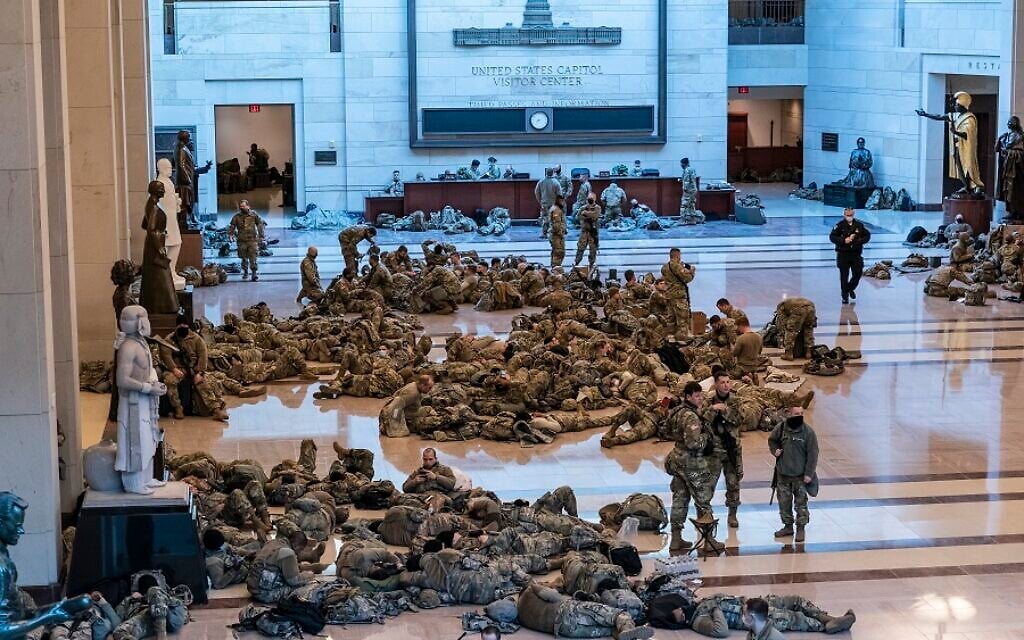 Hundreds of National Guard troops holed inside the Capitol Visitor's Center to reinforce security at the Capitol in Washington, Wednesday, Jan. 13, 2021. The House of Representatives is pursuing an article of impeachment against President Donald Trump for his role in inciting an angry mob to storm the Capitol last week. (AP Photo/J. Scott Applewhite Hundreds of National Guard troops holed inside the Capitol Visitor's Center to reinforce security at the Capitol in Washington, Wednesday, Jan. 13, 2021. The House of Representatives is pursuing an article of impeachment against President Donald Trump for his role in inciting an angry mob to storm the Capitol last week. (AP Photo/J. Scott Applewhite
