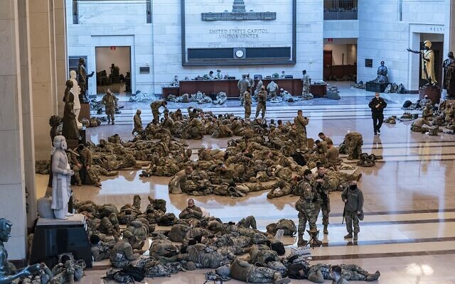 Hundreds of National Guard troops holed inside the Capitol Visitor's Center to reinforce security at the Capitol in Washington, Wednesday, Jan. 13, 2021. The House of Representatives is pursuing an article of impeachment against President Donald Trump for his role in inciting an angry mob to storm the Capitol last week. (AP Photo/J. Scott Applewhite