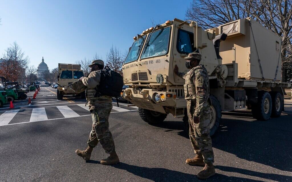 Members of the National Guard secure the perimeter around the Capitol, Wednesday, Jan. 13, 2021, in Washington as the House of Representatives continues with its fast-moving House vote to impeach President Donald Trump, a week after a mob of Trump supporters stormed the US Capitol. (AP Photo/Manuel Balce Ceneta) Members of the National Guard secure the perimeter around the Capitol, Wednesday, Jan. 13, 2021, in Washington as the House of Representatives continues with its fast-moving House vote to impeach President Donald Trump, a week after a mob of Trump supporters stormed the US Capitol. (AP Photo/Manuel Balce Ceneta)