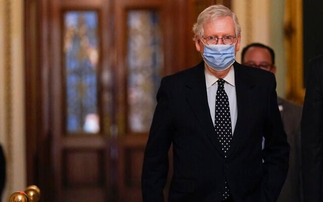 Senate Majority Leader Mitch McConnell walks from the Senate floor to his office, on Capitol Hill in Washington, January 6, 2021. (Manuel Balce Ceneta/AP) Senate Majority Leader Mitch McConnell walks from the Senate floor to his office, on Capitol Hill in Washington, January 6, 2021. (Manuel Balce Ceneta/AP)