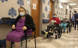 Nursing home residents in line to receive COVID-19 vaccines at Harlem Center for Nursing and Rehabilitation, a nursing home facility in New York, January 15, 2021. (AP Photo/Yuki Iwamura)