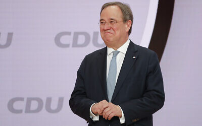 The new elected Christian Democratic Union (CDU) party chairman Armin Laschet stands on the podium after the voting at a digital party convention in Berlin, Germany, January 16, 2021. (AP Photo/Markus Schreiber)
