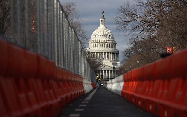 Steel fencing and barb wire surround the Capitol building as security is heightened ahead of US President-elect Joe Biden's inauguration ceremony, in Washington, January 19, 2021. (Rebecca Blackwell/AP)