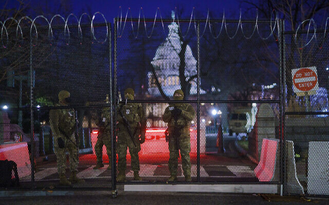 National Guard troops reinforce the security zone before US-President-elect Joe Biden is sworn in as the 46th president on Capitol Hill in Washington DC, January 19, 2021. (J. Scott Applewhite/AP)