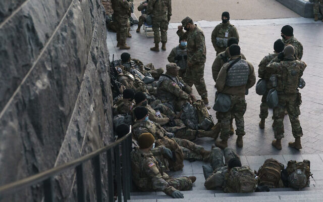 National Guard troops reinforce the security zone on Capitol Hill in Washington, Tuesday, Jan. 19, 2021, before President-elect Joe Biden is sworn in as the 46th president on Wednesday. (AP Photo/J. Scott Applewhite)