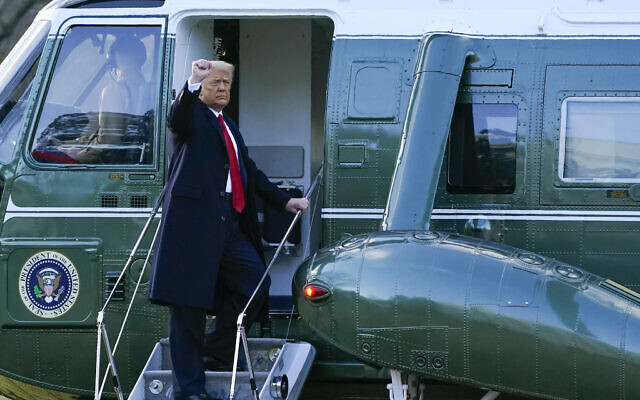 US President Donald Trump gestures as he boards Marine One on the South Lawn of the White House, January 20, 2021, in Washington. (Alex Brandon/AP)