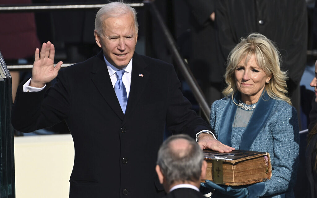 Joe Biden is sworn in as the 46th president of the United States by Chief Justice John Roberts as Jill Biden holds the Bible during the 59th Presidential Inauguration at the US Capitol in Washington, Wednesday, Jan. 20, 2021.(Saul Loeb/Pool Photo via AP)