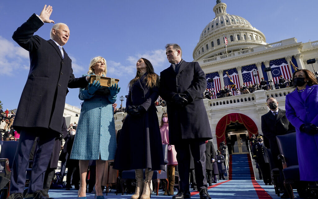 Joe Biden is sworn in as the 46th president of the United States by Chief Justice John Roberts as Jill Biden holds the Bible during the 59th Presidential Inauguration at the US Capitol in Washington, Jan. 20, 2021, as their children Ashley and Hunter watch. (AP Photo/Andrew Harnik, Pool)