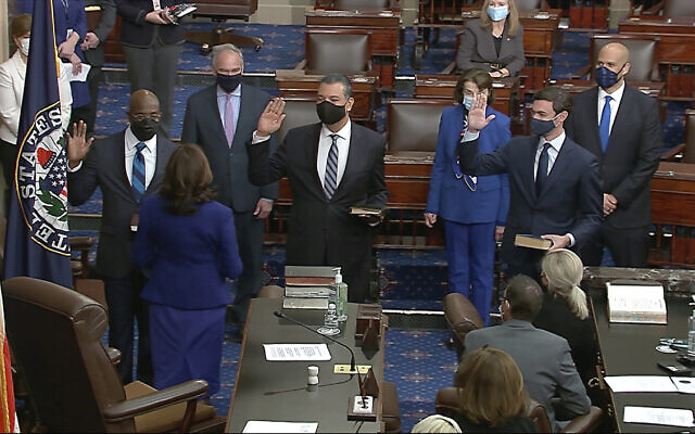 In this image from video, US Vice President Kamala Harris swears in Sen. Raphael Warnock, D-Ga., Sen. Alex Padilla, D-Calif., and Sen. Jon Ossoff, D-Ga., on the floor of the Senate Wednesday, Jan. 6, 2021, on Capitol Hill in Washington. (Senate Television via AP) In this image from video, US Vice President Kamala Harris swears in Sen. Raphael Warnock, D-Ga., Sen. Alex Padilla, D-Calif., and Sen. Jon Ossoff, D-Ga., on the floor of the Senate Wednesday, Jan. 6, 2021, on Capitol Hill in Washington. (Senate Television via AP)