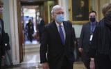 Sen. Mitch McConnell, R-Ky., the top Republican in Senate, leaves the chamber after Vice President Kamala Harris swore in three new Democratic senators, at the Capitol in Washington, Wednesday, Jan. 20, 2021. The victory by the two candidates in the pivotal Georgia runoff election this month was decisive in handing Democrats the majority in the Senate and forcing McConnell to become the minority leader. (AP Photo/J. Scott Applewhite)