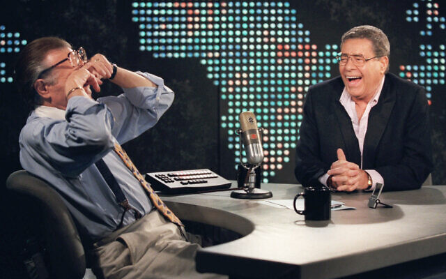 In this Thursday, Aug. 26, 1999, file photo, talk show host Larry King wipes his eyes after laughing at a joke by comedy legend Jerry Lewis, on the set of "Larry King Live" at CNN Studios in the Hollywood section of Los Angeles.(AP Photo/Chris Pizzello, File) In this Thursday, Aug. 26, 1999, file photo, talk show host Larry King wipes his eyes after laughing at a joke by comedy legend Jerry Lewis, on the set of "Larry King Live" at CNN Studios in the Hollywood section of Los Angeles.(AP Photo/Chris Pizzello, File)