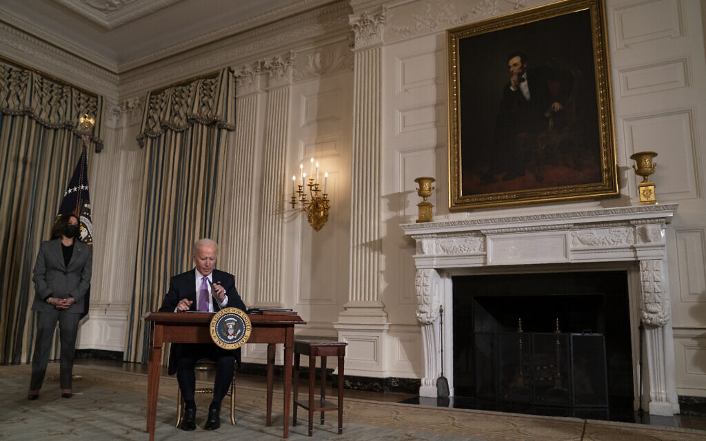 US Vice President Kamala Harris looks on as President Joe Biden signs a series of executive orders in the State Dining Room of the White House, January 26, 2021, in Washington. (AP Photo/Evan Vucci) US Vice President Kamala Harris looks on as President Joe Biden signs a series of executive orders in the State Dining Room of the White House, January 26, 2021, in Washington. (AP Photo/Evan Vucci)