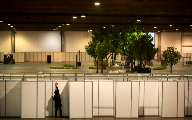 A worker cleans the cabins of a newly set up COVID-19 vaccination center at the Brussels Expo exhibition center in Brussels, Jan. 28, 2021 (AP Photo/Francisco Seco) A worker cleans the cabins of a newly set up COVID-19 vaccination center at the Brussels Expo exhibition center in Brussels, Jan. 28, 2021 (AP Photo/Francisco Seco)