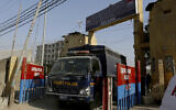 A police van is driven out from the Karachi Central Prison where British-born Pakistani Ahmed Omar Saeed Sheikh, who was charged, convicted and later acquitted in the 2002 murder of American journalist Daniel Pearl, is detained, in Karachi, Pakistan, Friday, Jan. 29, 2021. Pakistan is scrambling to manage the fallout of a Supreme Court decision to free the Pakistani-British man accused in the 2002 beheading of American Journalist Daniel Pearl. The Sindh Provincial government on Friday filed a review petition, asking the same court to revisit its decision. (AP Photo/Fareed Khan)