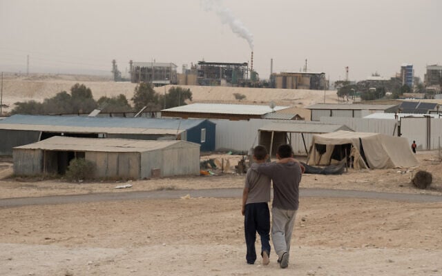The unrecognized Bedouin villages around the Ramat Hovav industrial area in southern Israel suffer from a high level of air pollution from nearby chemical evaporation ponds and an Israel Electric Company power plant, December 28, 2017. (Yaniv Nadav/Flash90/File) The unrecognized Bedouin villages around the Ramat Hovav industrial area in southern Israel suffer from a high level of air pollution from nearby chemical evaporation ponds and an Israel Electric Company power plant, December 28, 2017. (Yaniv Nadav/Flash90/File)