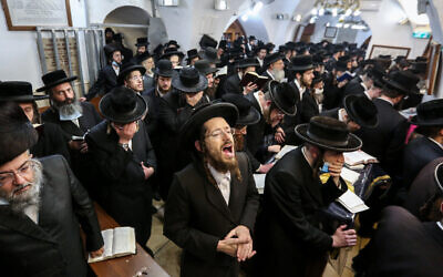 Illustrative: Ultra-Orthodox men during a ceremony in Meron, near Safed, on December 7, 2020. (David Cohen/Flash90)