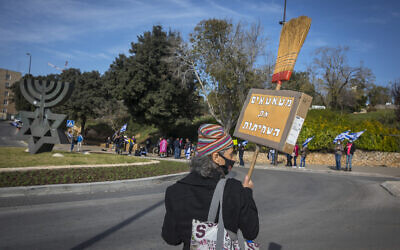 Israelis protest against Prime Minister Benjamin Netanyahu outside the Knesset in Jerusalem on December 28, 2020. (Olivier Fitoussi/Flash90)