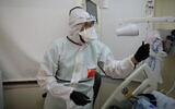 Team member works in the coronavirus department of Ichilov hospital in Tel Aviv, on January 1, 2021 (Tomer Neuberg/Flash90)