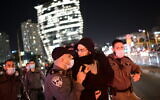 Police clash with protesters during a protest over the death Ahuvia Sandak in a car crash during a police chase, outside the home of Ministre of Public Security Amir Ohana in Tel Aviv, January 7, 2021. (Tomer Neuberg/Flash90)