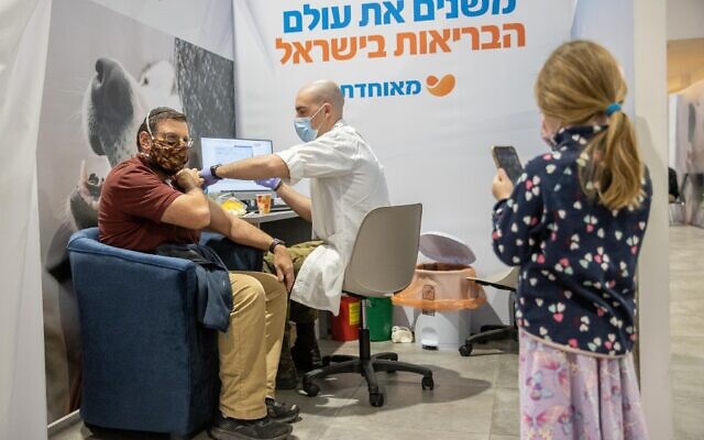 A man receives a shot at a Meuhedet COVID-19 vaccination center in Jerusalem, on January 7, 2021. (Yonatan Sindel/Flash90) A man receives a shot at a Meuhedet COVID-19 vaccination center in Jerusalem, on January 7, 2021. (Yonatan Sindel/Flash90)