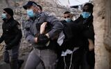 Police clash with ultra-Orthodox Jewish men while enforcing lockdown rules in Jerusalem's Mea Shearim neighborhood on January 14, 2021. (Yonatan Sindel/Flash90)
