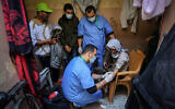 The Palestinian Ministry of Health crews conduct random checks through blood in the town of Rafah, southern Gaza Strip, on January 14, 2021. For the first time, preventive medicine will contact citizens to complete hundreds of checks during blood sampling, to avoid violating the curfew measures. The blood test helps measure anti-bodies. (Abed Rahim Khatib/Flash90)