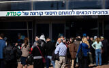 People wait in line to receive a coronavirus vaccine at a Clalit vaccination center in Jerusalem on January 21, 2021. (Yonatan Sindel/Flash90)