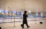 Illustrative: A man walks through the almost empty Ben Gurion International Airport on January 24, 2021 (Flash90)