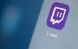 The streaming video platform Twitch logo seen on a tablet screen in July 2019. (Martin Bureau/AFP via Getty Images/JTA)