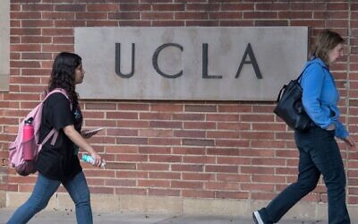 Illustrative -- People walk through the campus of the UCLA college in Westwood, California on March 6, 2020 (Photo by MARK RALSTON/AFP via Getty Images via JTA)