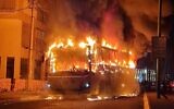 A bus set alight by an ultra-Orthodox mob in the city of Bnei Brak, January 24, 2021. (Israel Police)