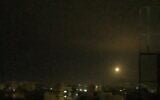 Illustrative: A Syrian anti-aircraft missile is fired into sky near Damascus during an alleged Israeli airstrike on January 6, 2021. (Screen capture: SANA)