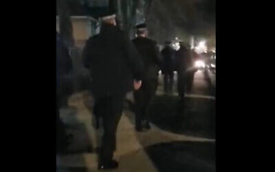 Metropolitan Police break up a wedding held at an ultra-Orthodox girls high school for violating lockdown rules, in London's Stamford Hill neighborhood, January 21, 2021. (Screen capture: YouTube)