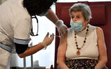 A nurse administers a dose of the Pfizer-BioNTech COVID-19 vaccine in Bobigny, a northeastern suburbs of Paris, France, December 30, 2020. (Stephane De Sakutin/AFP)