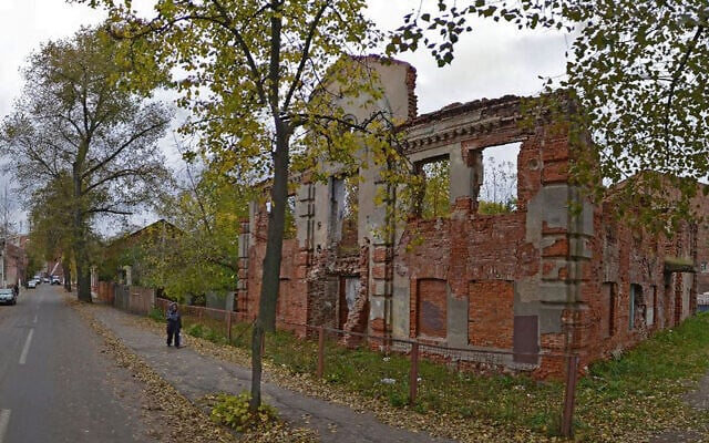 A woman walks past the ruins of the Great Lubavitch Synagogue in Vitebsk, Belarus. (Courtesy/Municipality of Vitebsk via JTA) A woman walks past the ruins of the Great Lubavitch Synagogue in Vitebsk, Belarus. (Courtesy/Municipality of Vitebsk via JTA)