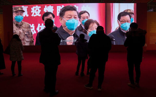 Wuhan residents attend an exhibition on the city's fight against the coronavirus, January 23, 2021. (AP Photo/Ng Han Guan) Wuhan residents attend an exhibition on the city's fight against the coronavirus, January 23, 2021. (AP Photo/Ng Han Guan)