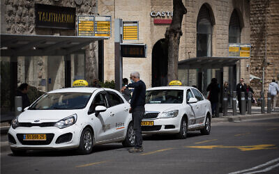Illustrative: Taxis wait for customers in Jerusalem, March 23, 2020. (Nati Shohat/Flash90)